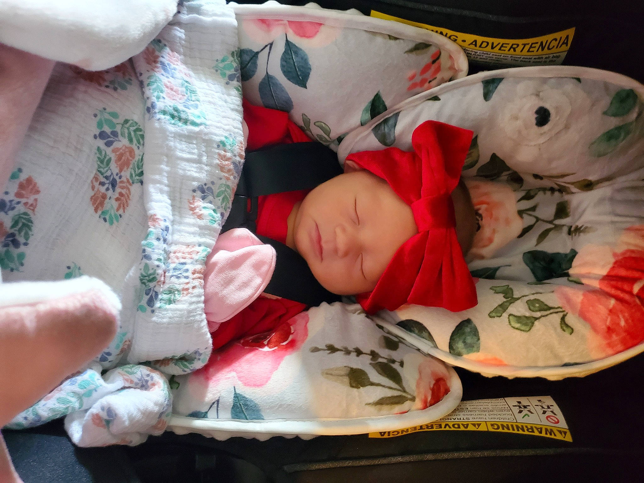 Ava is registered to the contest to win money with this photo: baby, baby_toddler_clothing, bedding, bedtime, carmine, child, christmas, christmas_eve, comfort, event, fictional_character, headwear, holiday, lap, linens, pattern, person, pillow, room, sitting