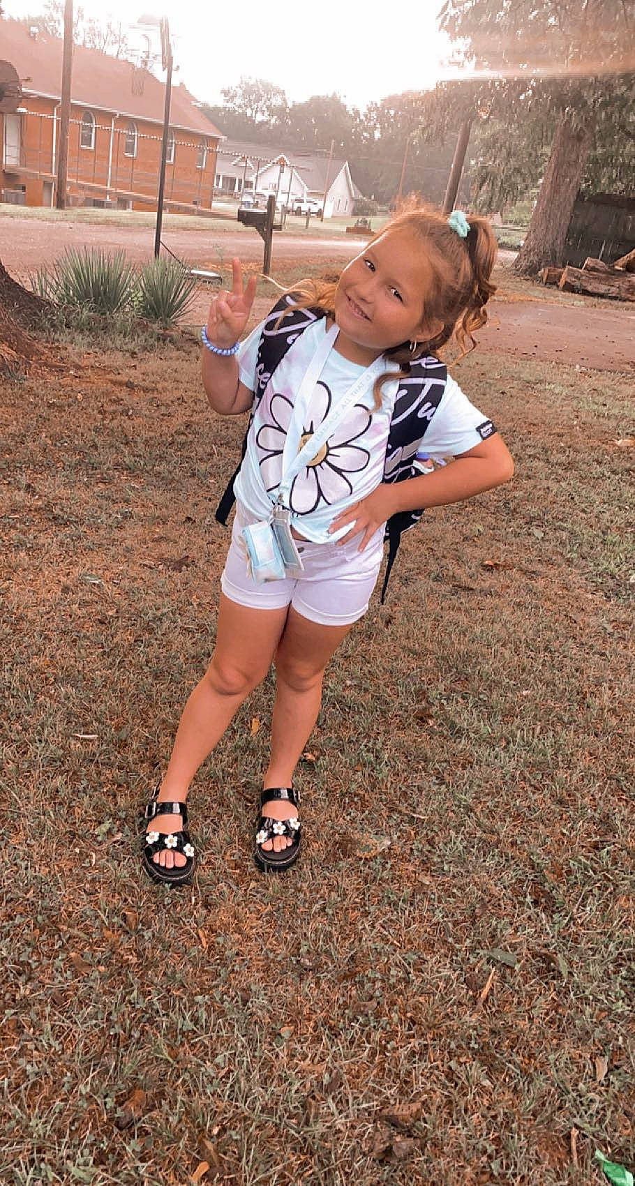 Ansley joined the competition — help win amazing prizes! calf, foot, fun, grass, happy, human_leg, joy, knee, landscape, leisure, long_hair, people_in_nature, person, plant, sandal, shorts, soil, sportswear, t_shirt, thigh