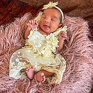 Elizabeth is registered to the contest to win money with this photo: baby, cozy, cute, dress, feet, flower, fluffy, hands, happy, headband, indoor, infant, lace, newborn, pink_cushion, portrait, resting, sleeping, smiling, soft_texture