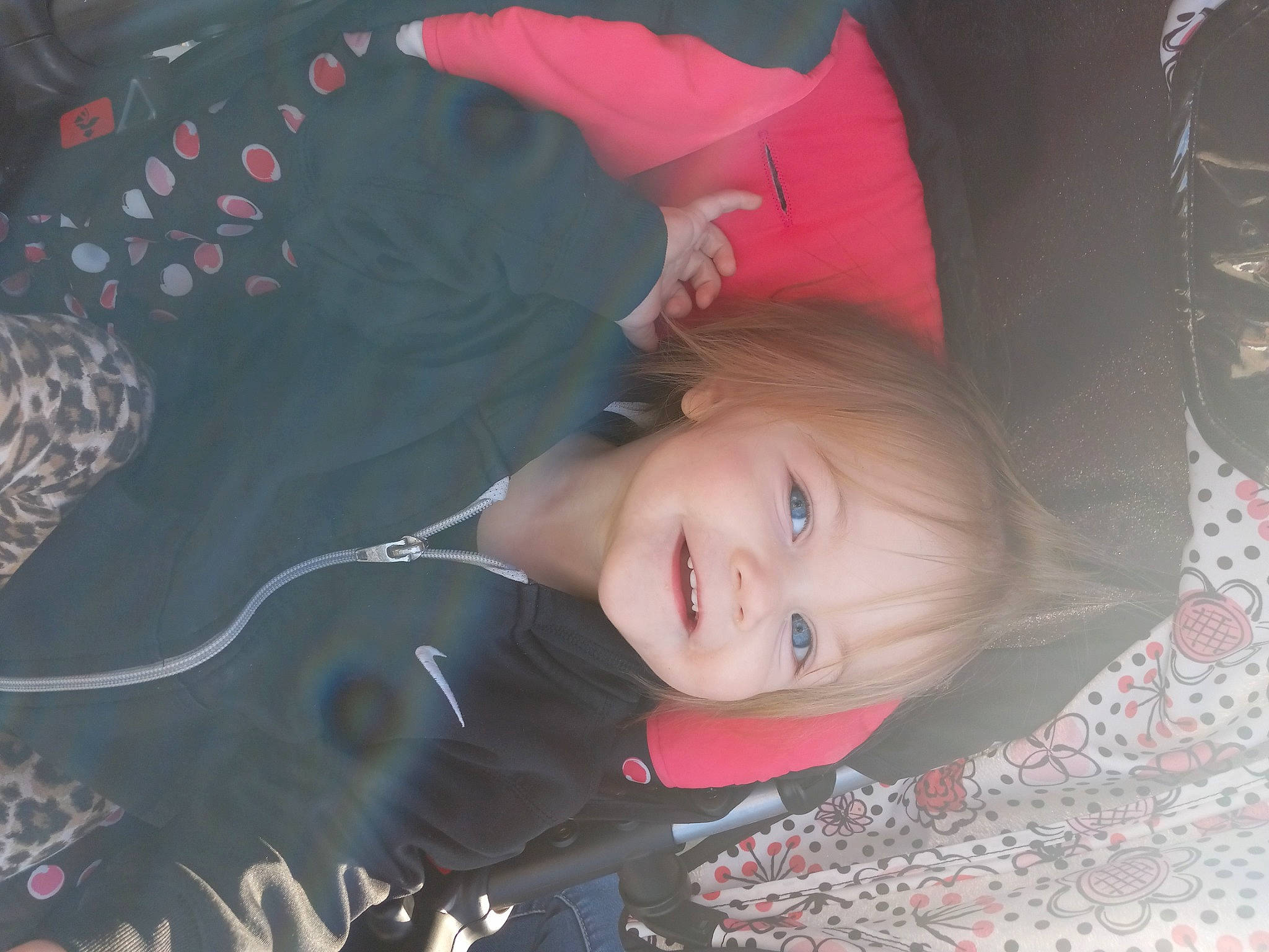 Ensley is registered to the contest to win money with this photo: baby, baby_toddler_clothing, cheek, child, fun, happy, head, iris, joy, lip, magenta, pattern, person, pink, portrait_photography, sitting, smile, toddler, tree, wood