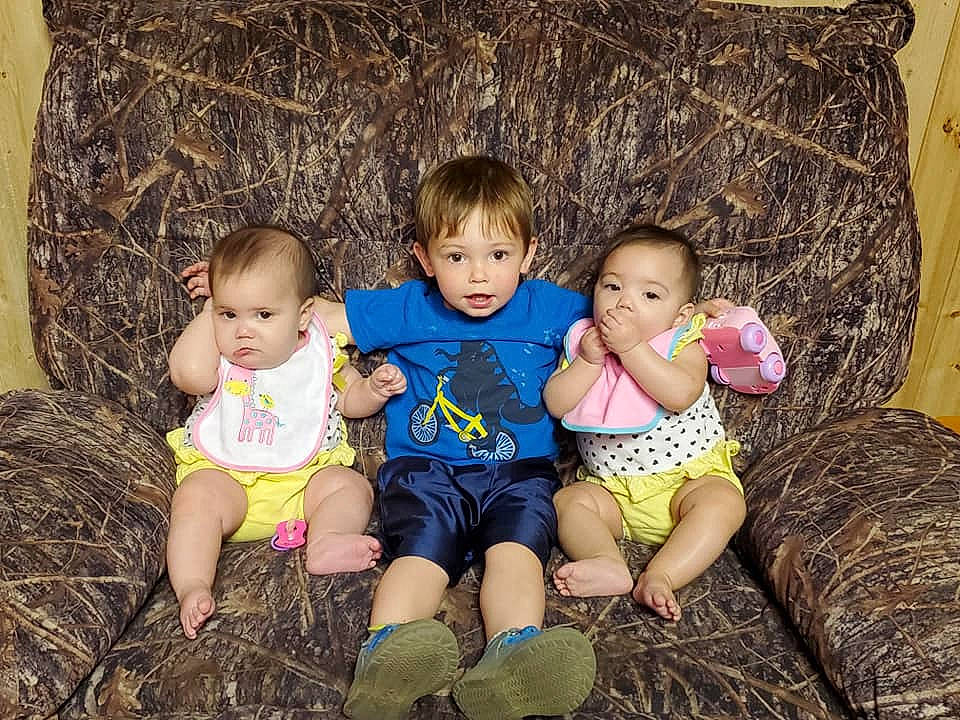 Edward is registered to the contest to win money with this photo: baby, child, cousin, family, fun, grass, happy, iris, leg, people, person, photography, plant, play, sibling, sitting, skin, smile, toddler, tree