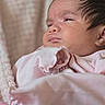 Desi joined the competition — help win amazing prizes! newborn, baby, infant, child, portrait, close_up, sleepy, face, eyes, hair, pink_clothing, blanket, swaddled, indoor, cozy, soft_lighting, sitting, cute, calm, photography
