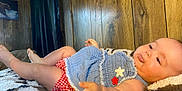 Penelope Grace joined the competition — help win amazing prizes! baby, infant, tongue_out, blue_top, red_checkered_shorts, blanket, wooden_wall, curtain, painting, indoor, child, cute, playful, skin, legs, hand, face, expression, cozy, relaxed