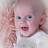 baby, blue_eyes, child, close_up, comfort, cozy, cute, hand, happy, head, indoors, infant, pink_blanket, portrait, resting, skin, smiling, soft_blanket, white_clothing, young