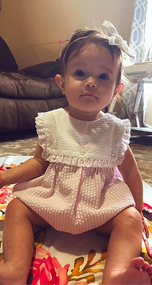 Jessa is registered to the contest to win money with this photo: baby_toddler_clothing, cheek, chin, dress, eyelash, facial_expression, finger, hairstyle, head, human, iris, lip, neck, nose, organ, person, pink, skin, sleeve, thigh