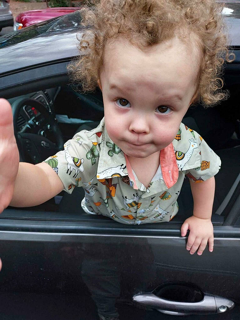 Sterling is registered to the contest to win money with this photo: auto_part, automotive_design, automotive_exterior, automotive_lighting, baby, baby_toddler_clothing, bumper, car, cheek, chin, fun, grass, happy, motor_vehicle, person, plant, toddler, vehicle, vehicle_door, window