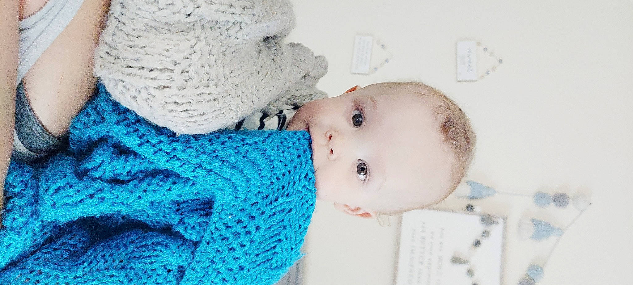 Sterling is registered to the contest to win money with this photo: art, baby, baby_products, baby_sleeping, baby_toddler_clothing, cap, cheek, child, comfort, electric_blue, eyelash, fashion_accessory, happy, head, headgear, pattern, person, sleeve, toddler, wool