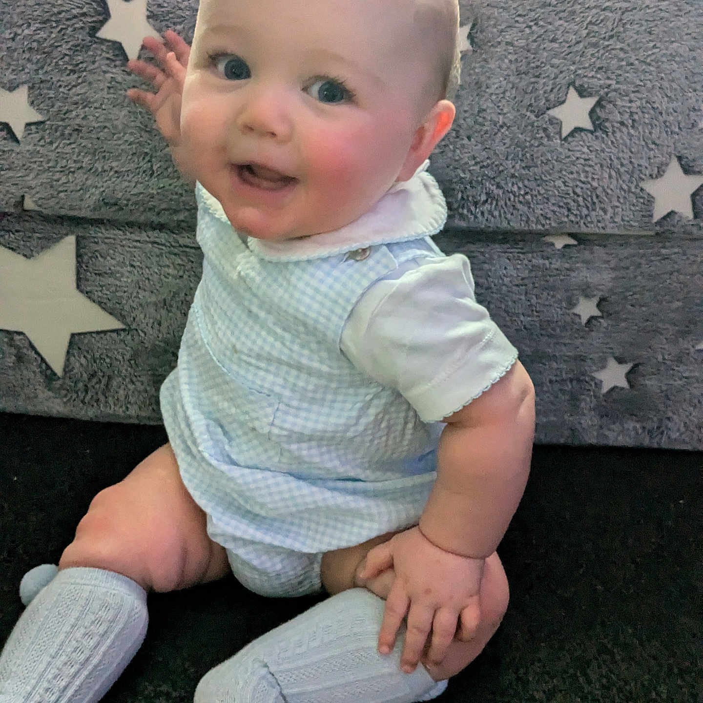 Kai-James joined the competition — help win amazing prizes! baby, background, blue_outfit, child, clothing, cute, eyes, face, fingers, hand, happy, indoors, infant, legs, sitting, skin, smiling, soft_texture, star_pattern, white_socks