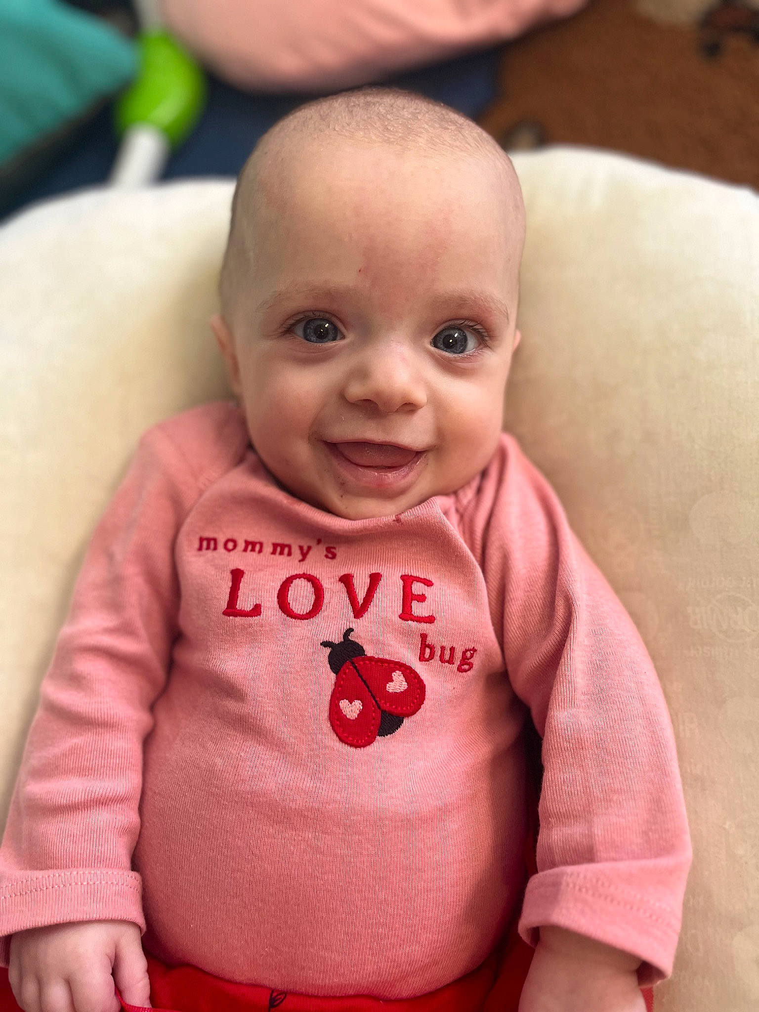 Emmy joined the competition — help win amazing prizes! baby, baby_toddler_clothing, cheek, comfort, dress, eye, eyelash, facial_expression, finger, happy, human, human_body, lip, mammal, nose, person, pink, skin, sleeve, smile