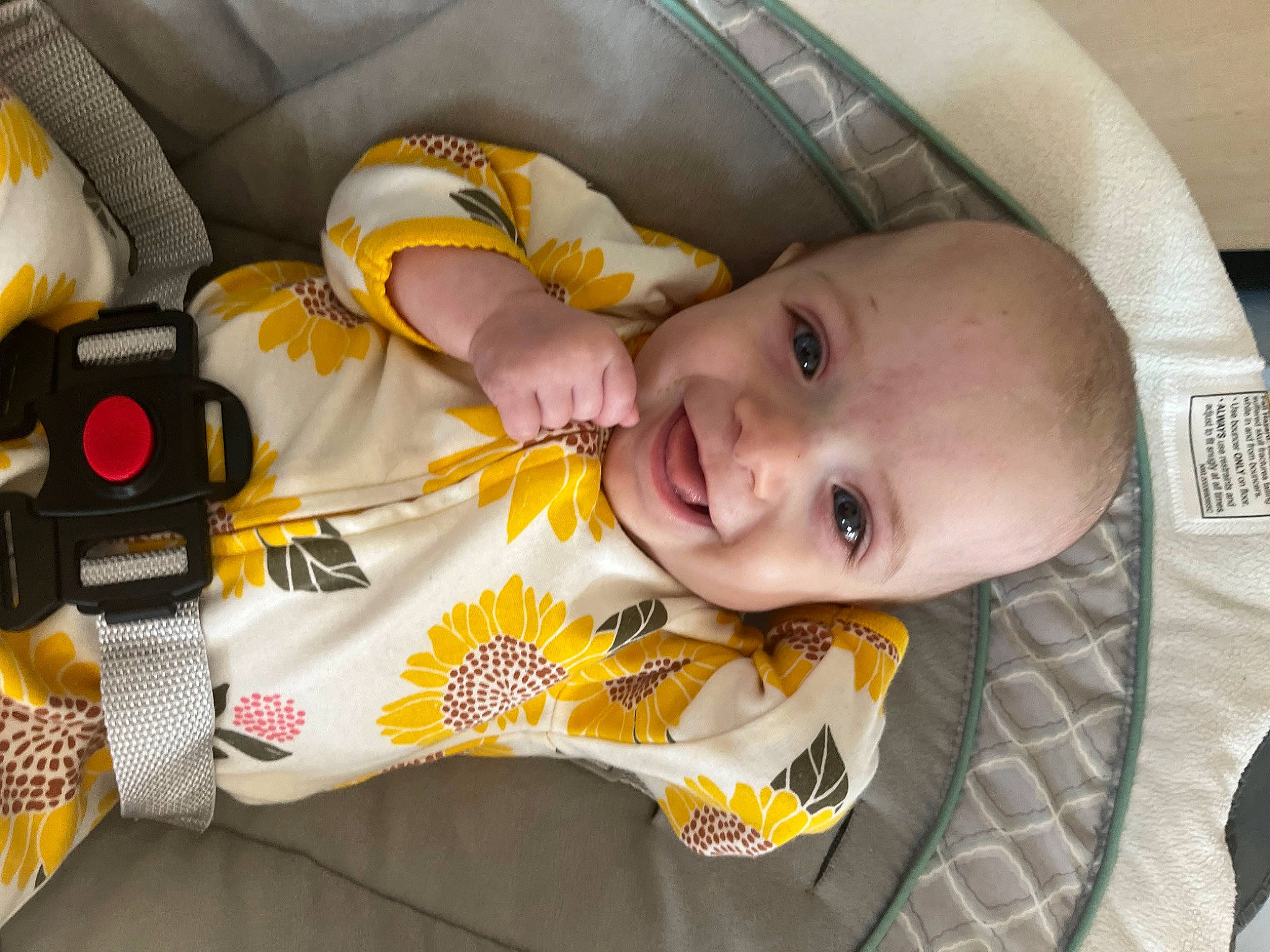 Emmy is registered to the contest to win money with this photo: baby, baby_carriage, baby_products, baby_safety, baby_toddler_clothing, black, car_seat, cheek, child, comfort, face, fun, happy, joy, linens, mouth, person, photograph, product, smile
