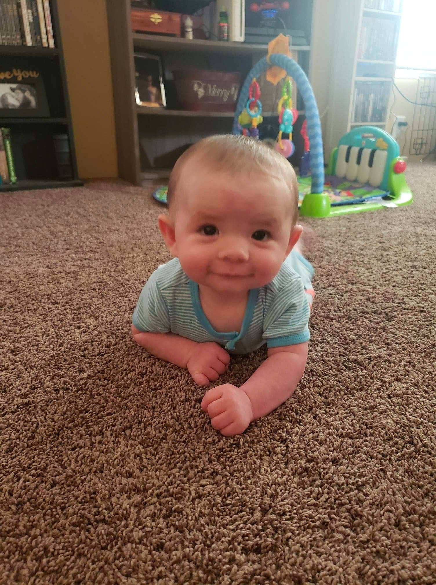 Cullen joined the competition — help win amazing prizes! baby, carpet, child, crawling, face, floor, flooring, fun, grass, head, person, play, sitting, skin, smile, soil, toddler