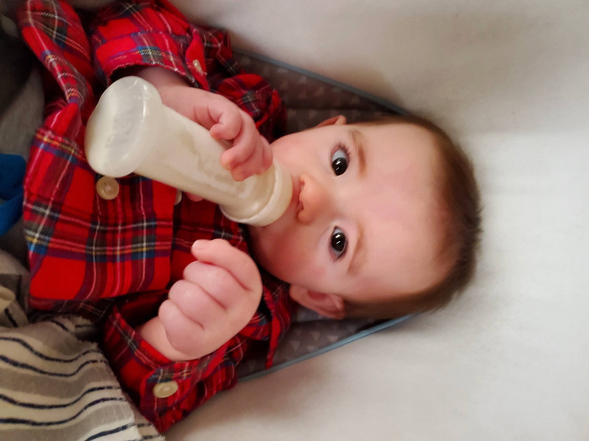 Cullen is registered to the contest to win money with this photo: baby, cheek, child, design, finger, hand, leg, lip, mouth, pattern, person, plaid, skin, tartan, textile, thumb, toddler