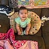 Priscilla joined the competition — help win amazing prizes! baby, blanket, bottle, child, colorful, couch, cozy, cute, drool, furniture, hello_kitty, home_interior, infant, patterned, pillow, plush, quilt, seated, smiling, socks
