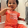 Love joined the competition — help win amazing prizes! baby, bright_colors, casual, child, closeup, countertop, curly_hair, cute, expression, finger_in_mouth, indoor, infant, mirror, orange_clothing, person, portrait, reflection, short_sleeves, sitting, toddler