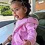 Antonielys is registered to the contest to win money with this photo: toddler, child, pink_hoodie, bow, hair, tongue_out, car, carport, outdoor, curly_hair, earrings, striped_shirt, sneakers, hand, face, expression, playful, young_child, casual_clothing, daylight