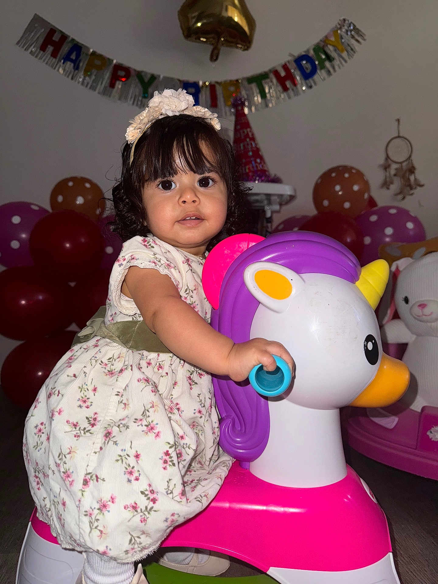 Antonielys joined the competition — help win amazing prizes! toddler, child, birthday_party, unicorn_toy, balloons, dress, headband, indoor, celebration, smiling, toy, floor, cute, curly_hair, decorations, party_hat, wall, happy, person, play