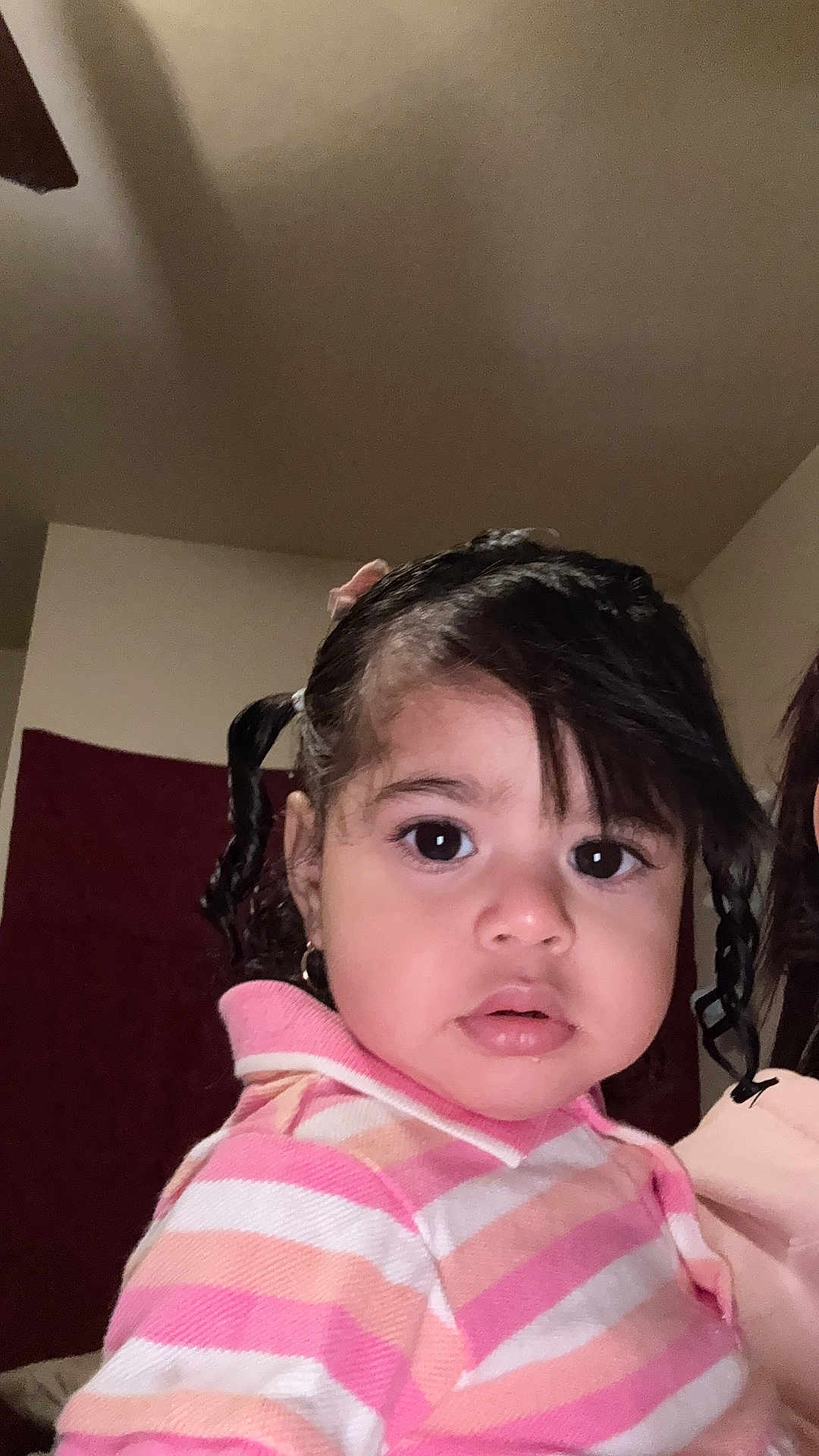 Antonielys is registered to the contest to win money with this photo: baby, big_eyes, child, clothing, curly_hair, cute, earrings, expression, face, hair, head, indoor, person, pigtails, pink, portrait, skin, striped_sweater, toddler, young_child