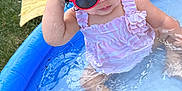 Antonielys is registered to the contest to win money with this photo: baby, child, cute, fun, grass, outdoor, pink_dress, play, pool, red_sunglasses, relaxing, sitting, summer, sunglasses, sunny, toddler, towel, water, water_play, wet_hair