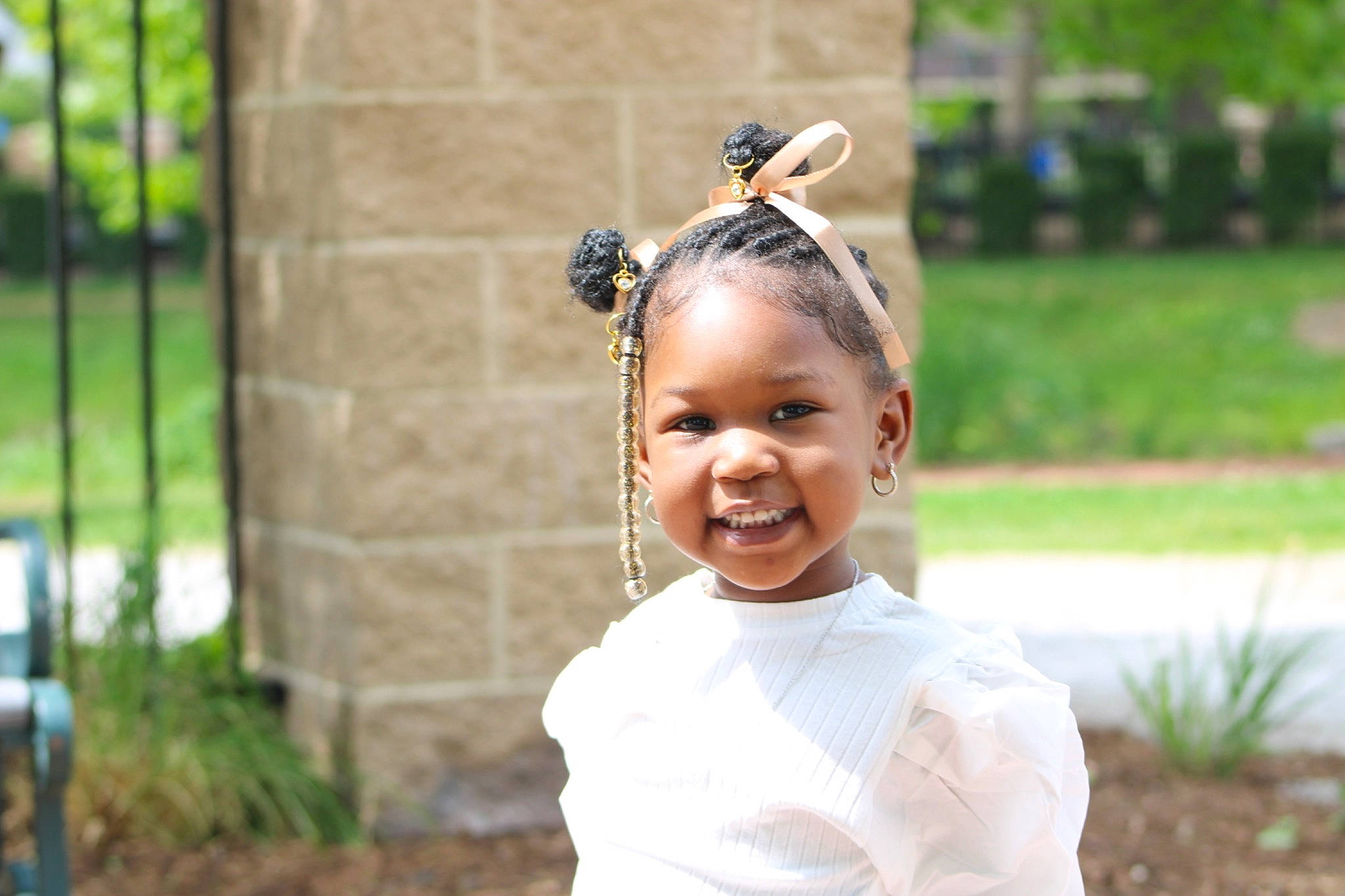 Amya is registered to the contest to win money with this photo: audio_equipment, child, event, eyewear, fashion_accessory, grass, hair_accessory, happy, headband, headpiece, iris, jewellery, joy, laugh, leisure, person, plant, recreation, smile, street_fashion