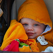 Nathanaël participe au concours pour gagner de l'argent avec cette photo : baby, baby_accessory, blanket, bundle, child, closeup, colorful_blanket, cozy, cute, face, happy, hoodie, infant, orange_clothing, pacifier, portrait, smile, stroller, warm_clothing, young_child