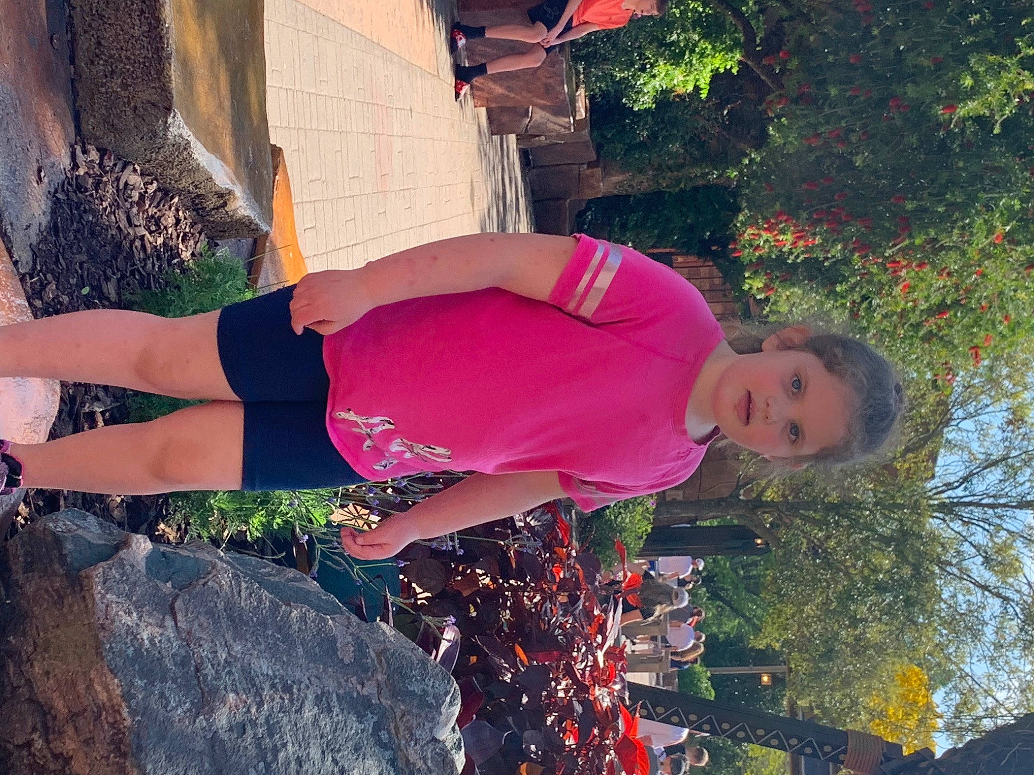 Bella is registered to the contest to win money with this photo: cool, fun, grass, happy, human_body, leg, leisure, magenta, morning, people_in_nature, person, pink, plant, red, shoulder, t_shirt, thigh, tints_and_shades, tree, trunk