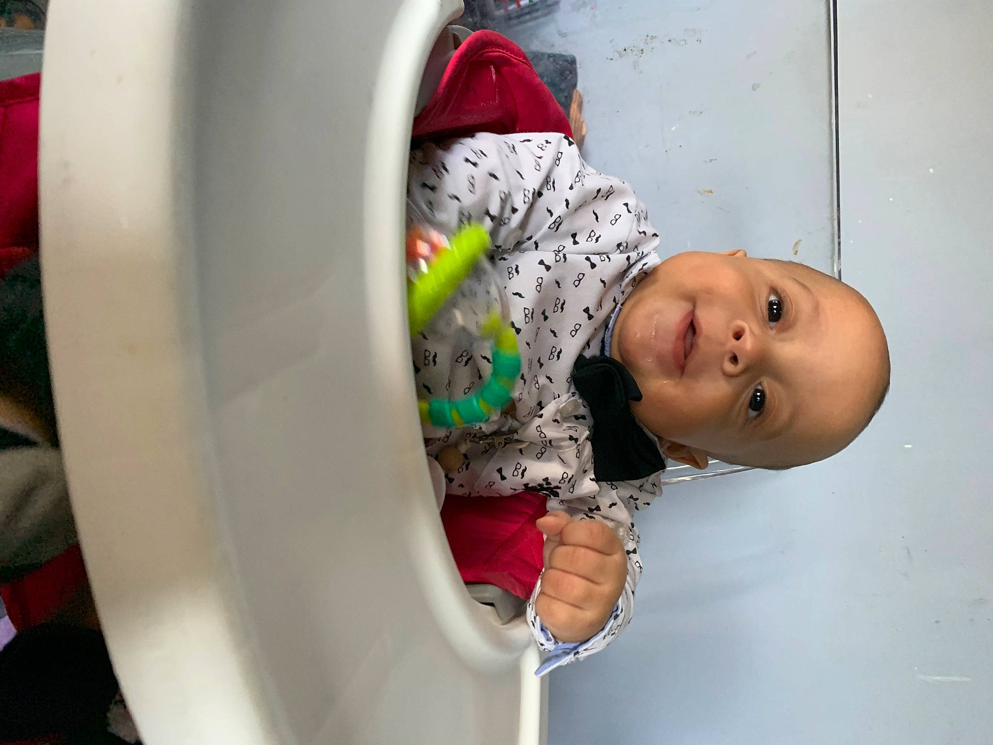 Keegan is registered to the contest to win money with this photo: automotive_tire, baby, baby_toddler_clothing, child, circle, fun, happy, hat, machine, person, room, toddler