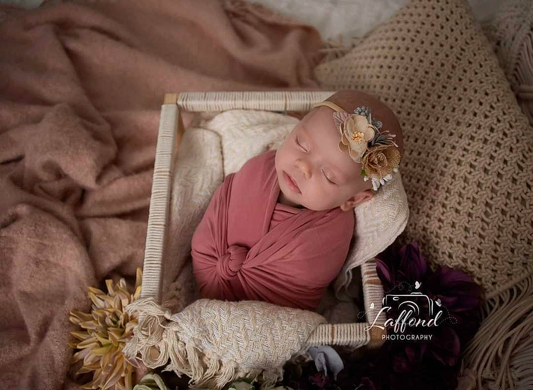 Adley joined the competition — help win amazing prizes! baby, baby_products, baby_toddler_clothing, chair, child, christmas, comfort, couch, event, fur, happy, hat, headwear, linens, person, portrait_photography, room, sitting, sleep, textile