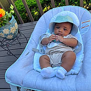 Genesis joined the competition — help win amazing prizes! baby, infant, baby_seat, hat, outdoor, deck, plant, flower_pot, greenery, wooden_floor, clothing, socks, baby_bib, relaxing, cute, portrait, child, sun_hat, baby_boy, summer