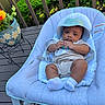 baby, infant, baby_seat, hat, outdoor, deck, plant, flower_pot, greenery, wooden_floor, clothing, socks, baby_bib, relaxing, cute, portrait, child, sun_hat, baby_boy, summer