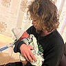 Alaysia joined the competition — help win amazing prizes! man, baby, newborn, hospital, swaddled, blanket, hat, medical_tubing, curly_hair, indoor, curtains, seated, holding, portrait, caring, love, family, person, healthcare, intimate