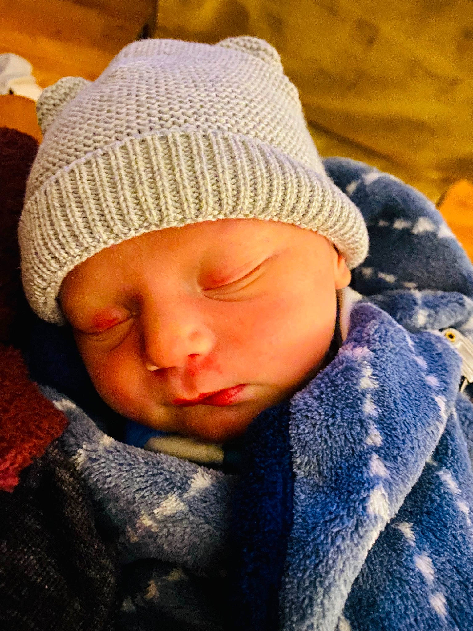 Silas is registered to the contest to win money with this photo: baby, baby_sleeping, baby_toddler_clothing, beanie, cap, cheek, child, chin, comfort, fashion_accessory, headgear, headwear, knit_cap, linens, pattern, person, sitting, skin, sleeve, toddler
