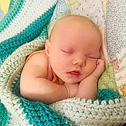 Everleigh joined the competition — help win amazing prizes! newborn, baby, sleeping, infant, portrait, face, closed_eyes, peaceful, blanket, crocheted_blanket, swaddled, lying_down, indoors, cozy, soft_lighting, close_up, baby_arms, textile, calm, adorable
