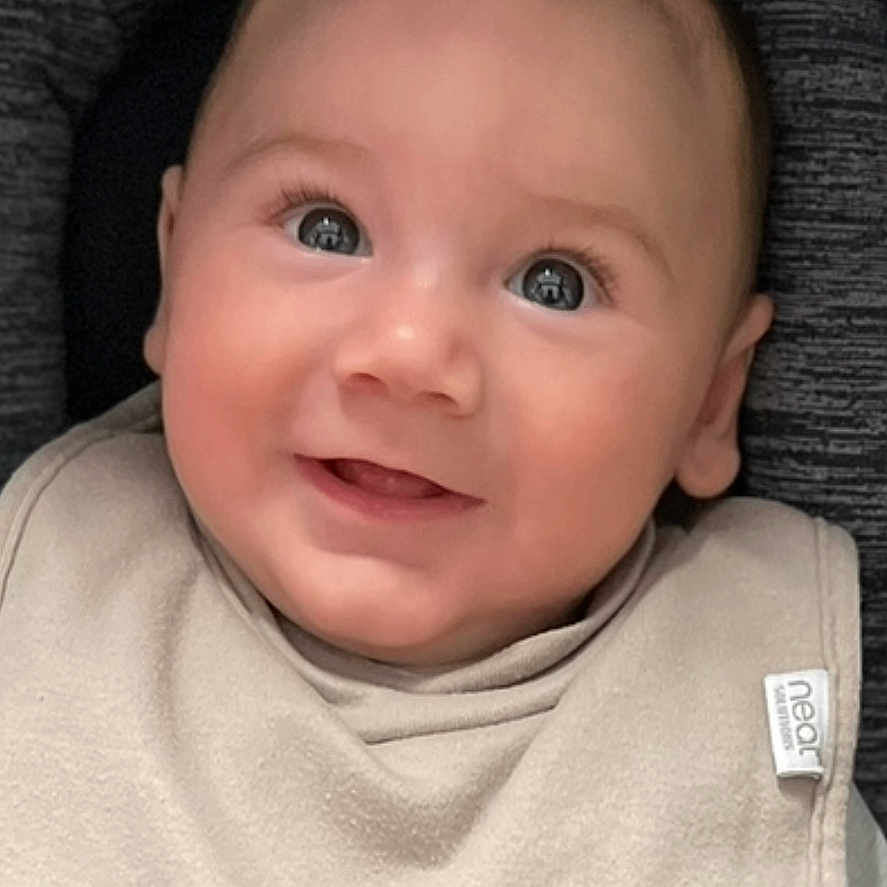 Wilson joined the competition — help win amazing prizes! baby, baby_boy, bib, car_seat, child, closeup, clothing, cute, eyes, face, happy, indoor, infant, portrait, safety, seatbelt, skin, smile, straps, young_child