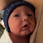 Wilson joined the competition — help win amazing prizes! newborn, baby, infant, wrapped, blanket, beanie, feeding_tube, face, closeup, skin, person, hospital, resting, cheek, curious, adult, chest, healthcare, medical, indoors