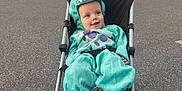 Kingston joined the competition — help win amazing prizes! child, baby, stroller, dinosaur_costume, hooded_costume, turquoise_costume, smile, happy, sitting, parking_lot, cars, asphalt, wheels, outdoor, fall_trees, parking, cute, infant, hood, portrait