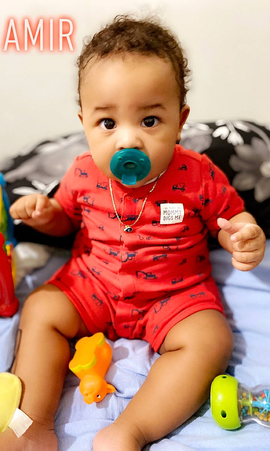 Amir is registered to the contest to win money with this photo: baby, baby_playing_with_toys, baby_products, baby_toddler_clothing, cheek, child, person, play, product, sitting, toddler, toy
