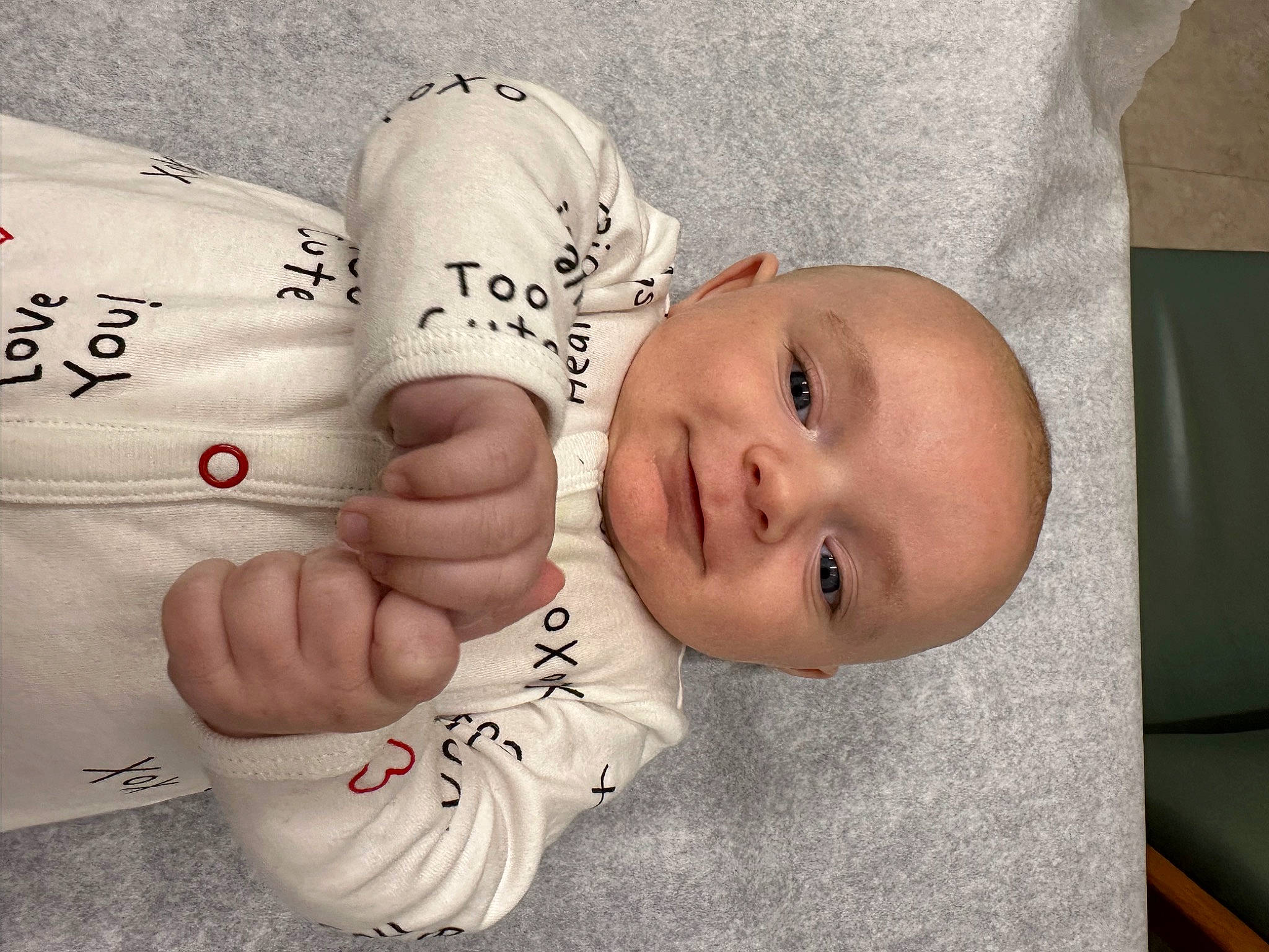Bentley is registered to the contest to win money with this photo: baby, baby_products, baby_safety, baby_toddler_clothing, child, comfort, eye, finger, font, gesture, hand, happy, linens, nail, person, product, skin, sleeve, smile, thumb