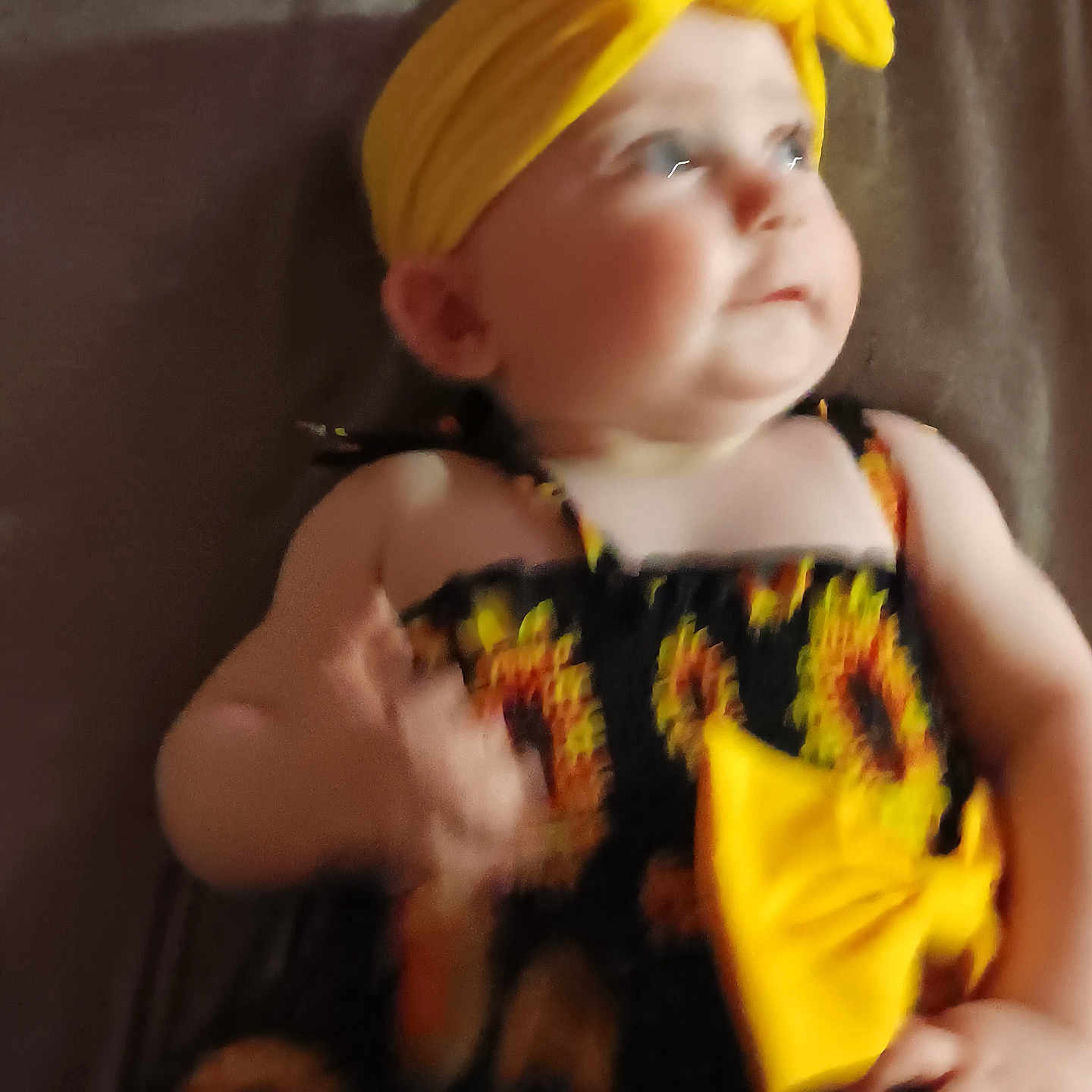 Paisley is registered to the contest to win money with this photo: accessories, baby, bodypart, clothing, costume, couch, dress, face, finger, flower, formalwear, furniture, hand, hat, head, headband, person, photography, portrait, toy