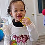 Kayline participe au concours pour gagner de l'argent avec cette photo : casual, cherry_print, child, clothing, curly_hair, door, face, hand, indoor, person, playing, playroom, portrait, rainbow_toy, shirt, smiling, toddler, toy, wooden_floor, yellow_toy