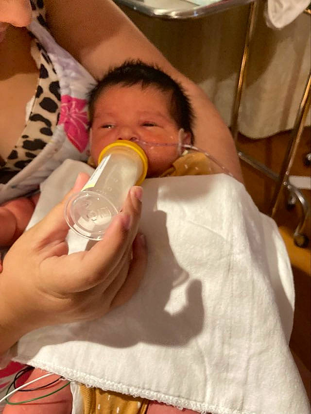 Vani is registered to the contest to win money with this photo: baby, baby_bottle, baby_products, bottle, cheek, child, comfort, drinking, drinkware, ear, eyelash, finger, hand, infant_formula, milk, nail, person, plastic_bottle, skin, thumb