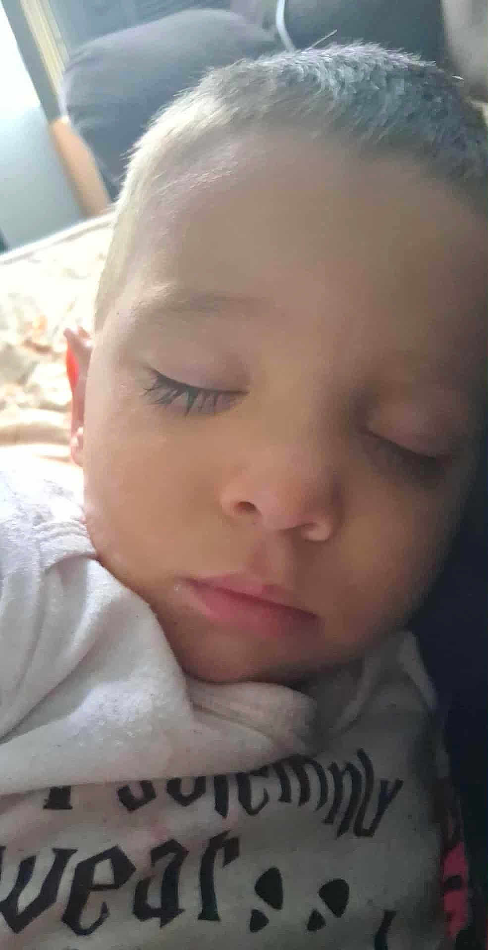 Vani Robert is registered to the contest to win money with this photo: baby, child, close_up, clothing, cute, eyelashes, face, head, indoors, infant, peaceful, portrait, rest, skin, sleep, sleeping, soft_light, text, white, young_child