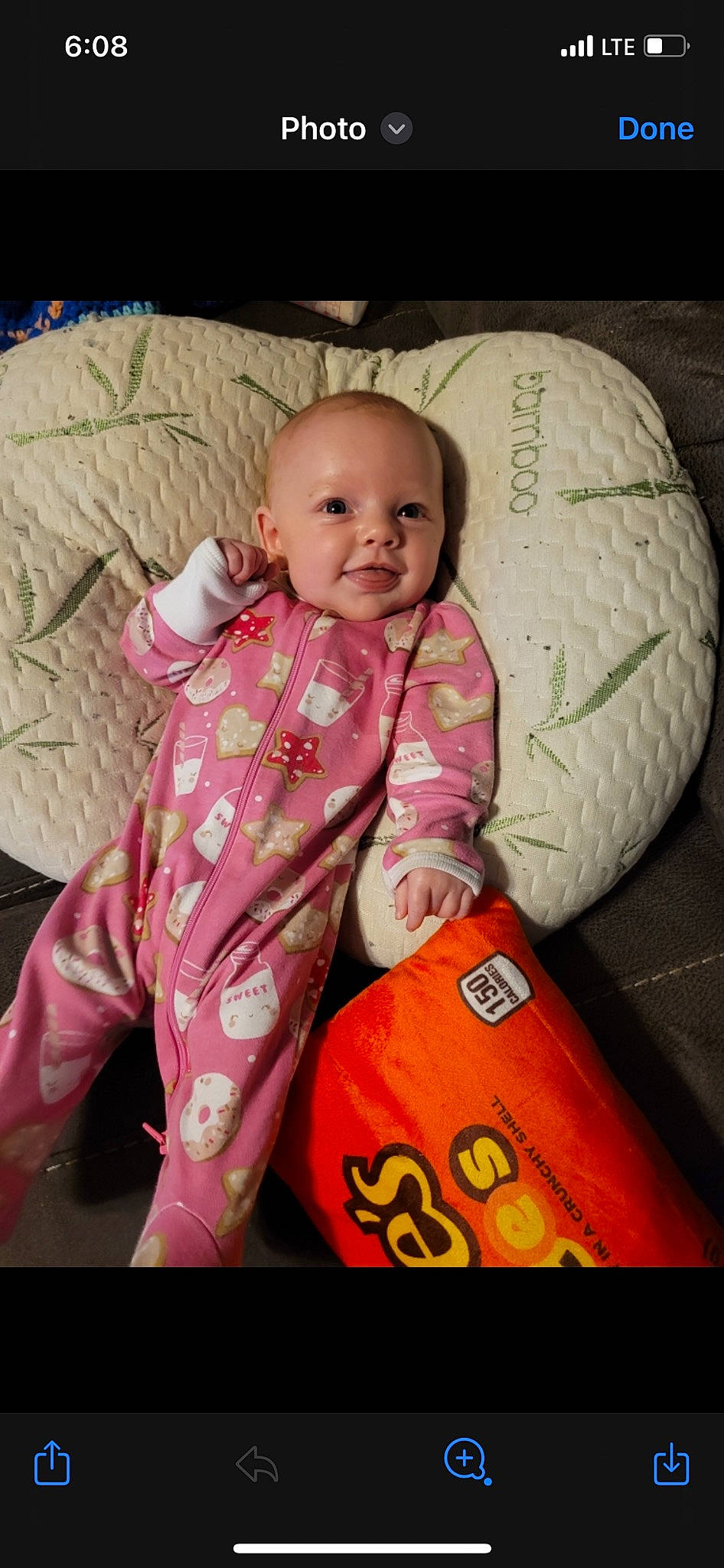 Araya is registered to the contest to win money with this photo: baby, baby_products, baby_toddler_clothing, cheek, child, comfort, facial_expression, fun, happy, linens, luggage_and_bags, nose, person, personal_protective_equipment, play, room, sitting, sleeve, smile, textile