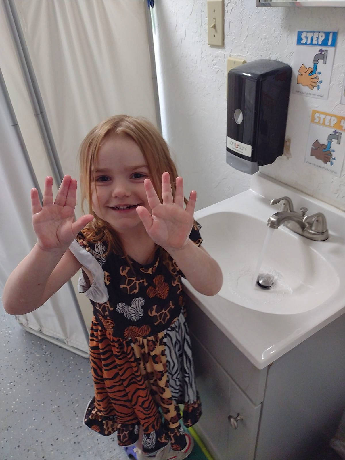 Emma joined the competition — help win amazing prizes! bathroom, bathroom_cabinet, bathroom_sink, countertop, curtain, flooring, gesture, hand, happy, hardwood, joy, mirror, person, plumbing, plumbing_fixture, purple, sink, sleeve, smile, tap