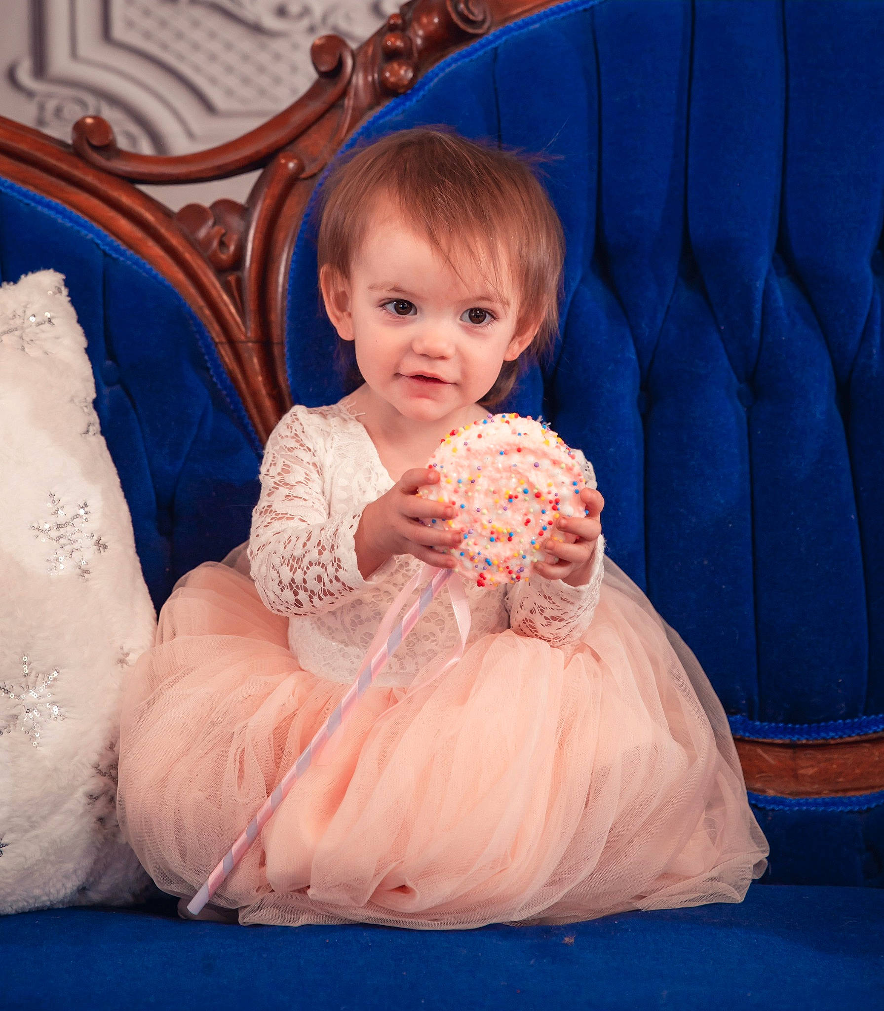 Kinsley is registered to the contest to win money with this photo: aqua, arm, azure, baby_toddler_clothing, blue, child, comfort, couch, day_dress, dress, electric_blue, fun, furniture, hairstyle, happy, human_body, linens, person, pink, textile