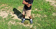 Ziyan joined the competition — help win amazing prizes! child, boy, sunglasses, black_tshirt, shorts, grass, outdoor, standing, shadow, sunny, greenery, casual_clothing, cool_pose, summer, nature, person, confident, yard, tree, footwear