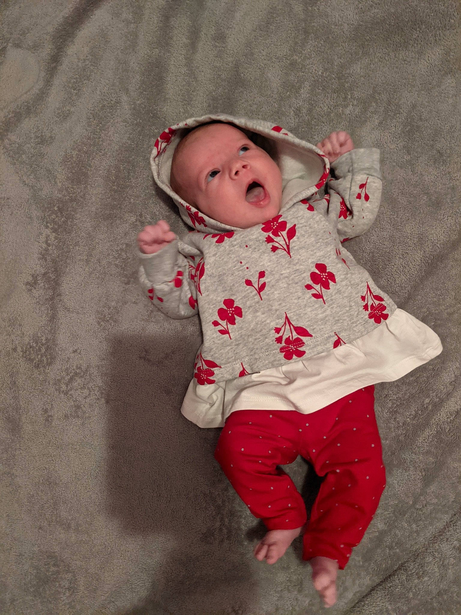 Maci is registered to the contest to win money with this photo: baby, baby_toddler_clothing, cheek, child, chin, dress, eye, grass, headgear, human_body, lip, nose, outerwear, pattern, person, pink, skin, sleeve, textile, toddler