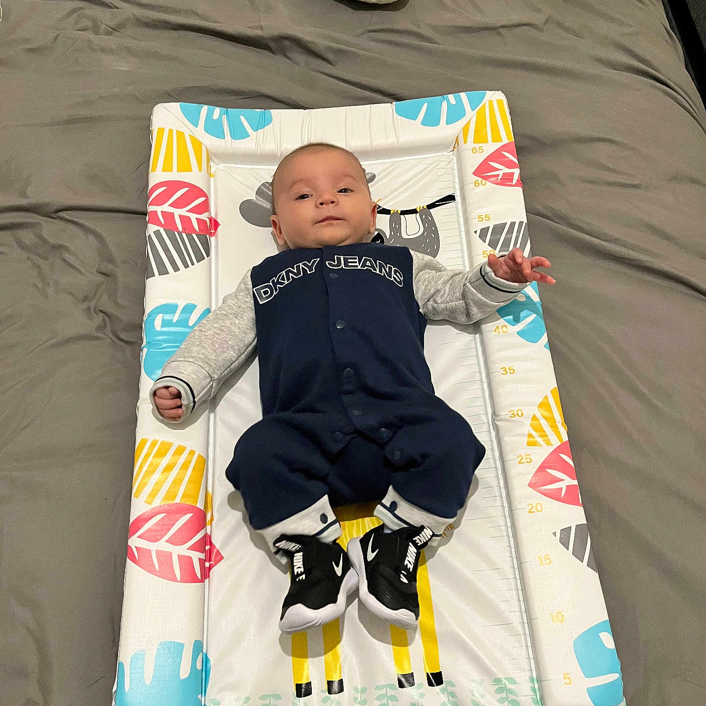 Oliver is registered to the contest to win money with this photo: baby, bed, blanket, bodypart, clothing, crib, cushion, face, finger, furniture, glove, hand, head, homedecor, infantbed, pants, person, photography, portrait, sleeping