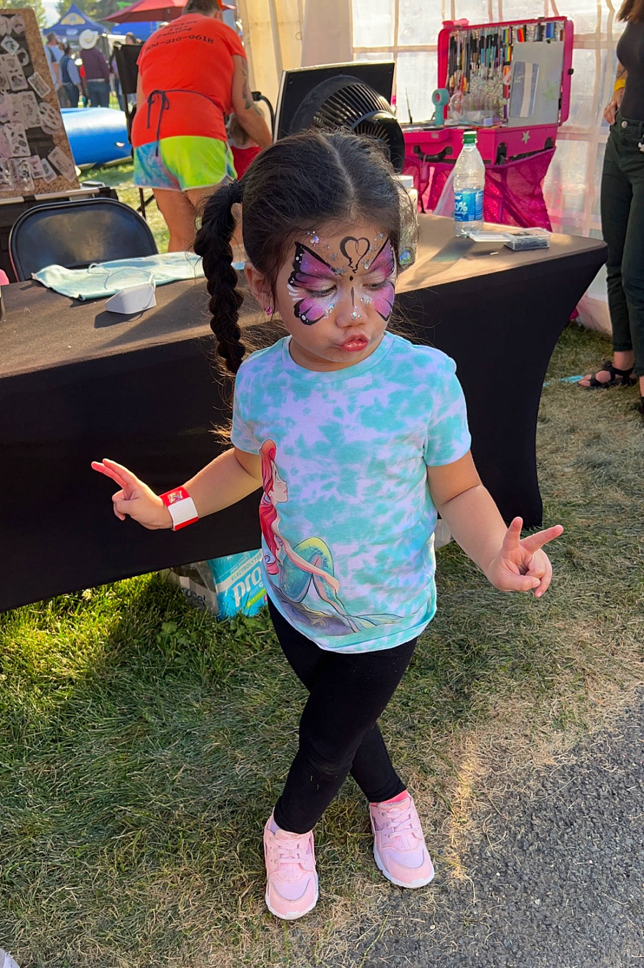 Emmalyn is registered to the contest to win money with this photo: child, city, event, eyewear, fun, grass, happy, leg, leisure, luggage_and_bags, person, pink, plant, play, recreation, shoe, shorts, t_shirt, toddler, vacation