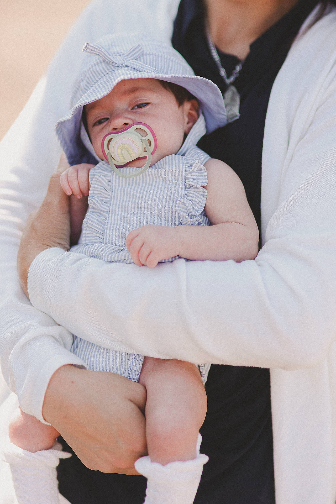 Vivienne is registered to the contest to win money with this photo: baby, bodypart, bonnet, cap, clothing, coat, face, finger, hand, happy, hat, head, knitwear, newborn, people, person, photography, portrait, smile, sweater