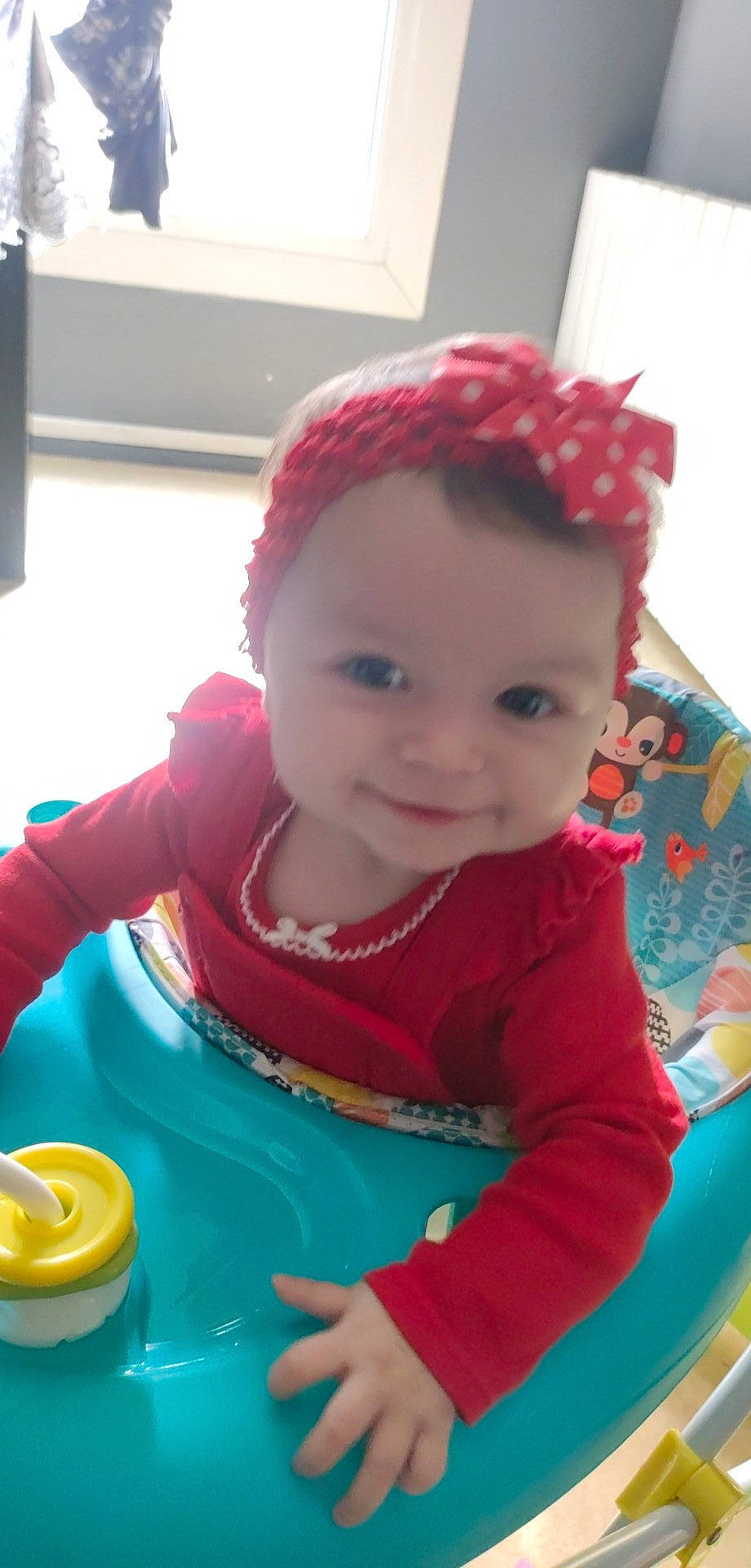 Mélina participe au concours pour gagner de l'argent avec cette photo : baby, baby_playing_with_toys, baby_products, baby_toddler_clothing, beanie, cap, cheek, child, costume_hat, fashion_accessory, fun, happy, joy, magenta, person, play, recreation, riding_toy, sitting, smile